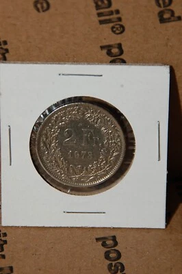 Moneda de 2 francos suizos 1973 en montaje de papel 2x2 Foto 1 de 4