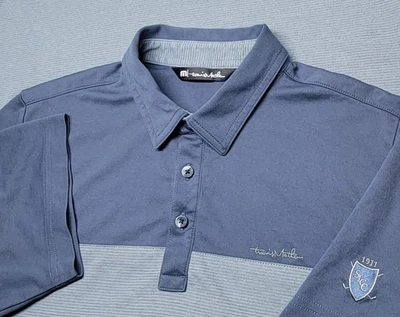 Polo de golf Travis Mathew material de ajuste seco para hombre talla mediana gris marino  Foto 1 de 4