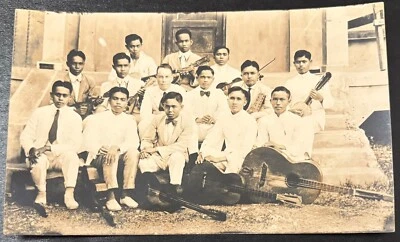 REAL PHOTO POSTCARD RPPC~12 YOUNG ASIAN MEN-GUITAR BANJO MANDOLIN-MUSIC MUSICIAN - Image 1 of 3