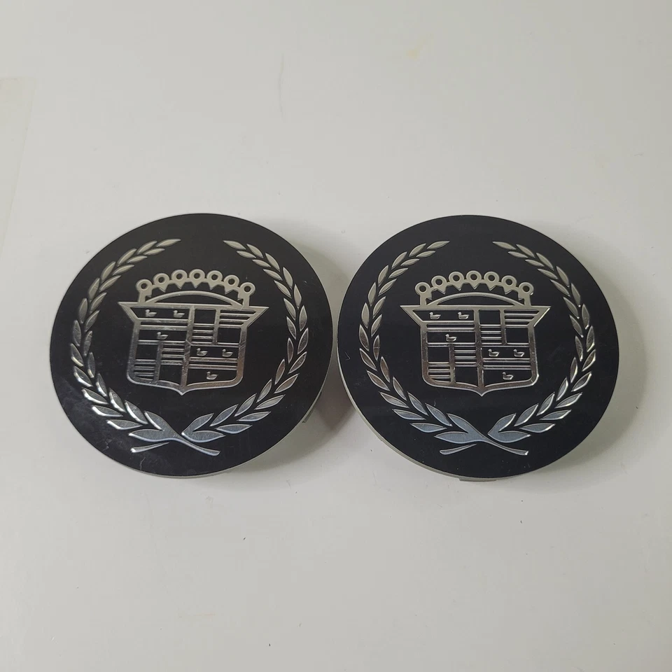 Juego de 2 tapas centrales de rueda negras para Cadillac GM 2005-2015 OEM ATS CTS DTS SRX STS Foto 1 de 4