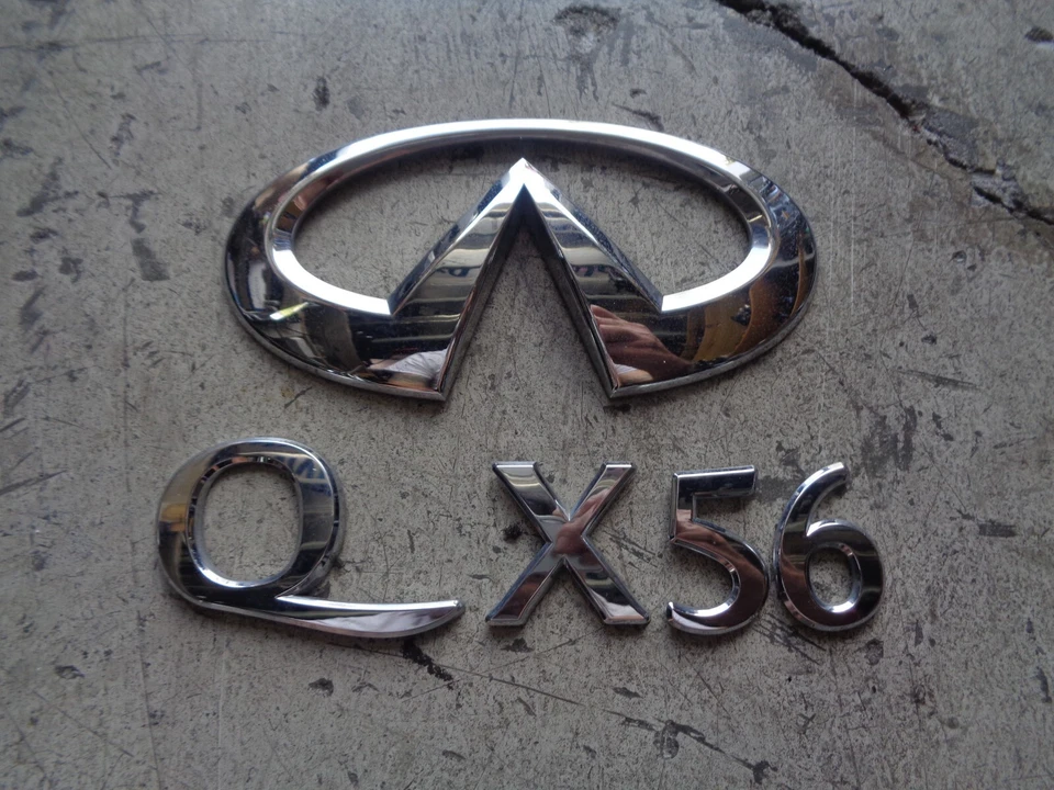 11 12 13 INFINITI QX56 EMBLEMA CROMADO TRASERO LOGOTIPO INSIGNIA SIGNO SÍMBOLO USADO OEM Foto 1 de 1