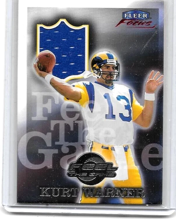KURT WARNER 1999 FLEER FOCUS FEEL THE GAME INSERT GAME USED ROOKIE JERSEY - Image 1 of 1