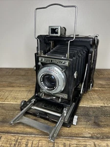 Cámara Graflex Speed Graphic 4x5 f/4,5 Raptar 114 mm lente Wollensak - Imagen 1 de 9