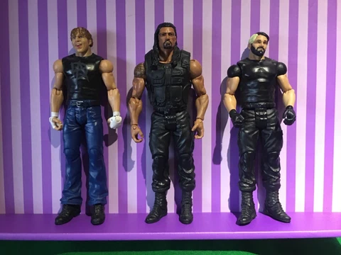WWE WWF MATTEL BASIC THE SHIELD SETH ROLLINS ROMAN REIGNS DEAN AMBROSE FIGURES Cover