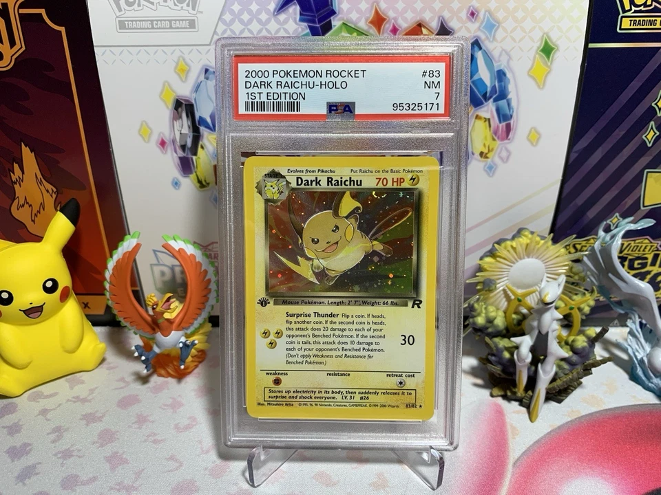 PSA 7 Pokemon 1st Edition Team Rocket Secret Rare Holo Dark Raichu – 83/82 - Image 1 of 1