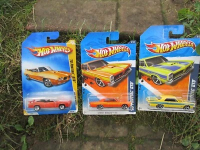 Lote de autos de juguete Pontiac GTO 1965 1970 2011 Street Beasts Hot Wheels Foto 1 de 4