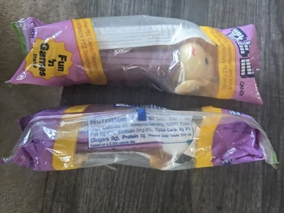 PEZ SHEEP ONE BEIGE FACE + ONE WHITE FACE LAMB CHOP? PURPLE STEMS PURPLE CELLO - Image 1 of 3