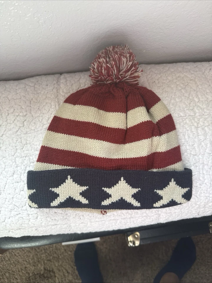 Beanie Hat Patriotic Red Beige Stars Stripes USA Flag Theme Fur Poof D&Y Patriot - Image 1 of 1