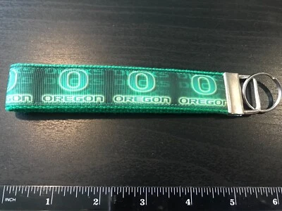 Universidad de Oregon, llaveros, llaveros, muñeca, universidad, cordón Foto 1 de 2