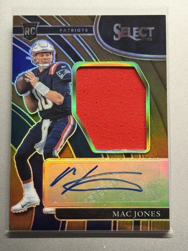 2021 Panini Select - Rookie Signature Swatches Prizm Mac Jones Copper Prizm /49 - Image 1 of 2