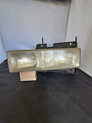 Faro camioneta Chevrolet GMC 1990 2002 15602613 GM Foto 1 de 4