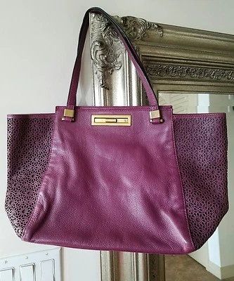  Bolso de Mano ELLIOTT LUCCA Púrpura Ciruela Patrón Corte Cuero Usado  Foto 1 de 4