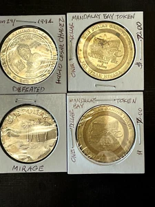 MGM GRAND'S 1994 CHAVEZ BOXING MACH, 2 MANDALA BAY & 1 MIRAGE 1$ GAMING TOKENS. - Picture 1 of 4