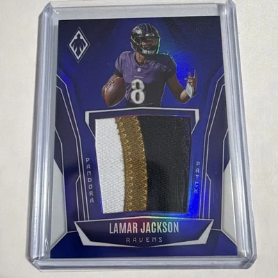 2025 Panini Phoenix Lamar Jackson Pandora Patch /199  - Image 1 of 3