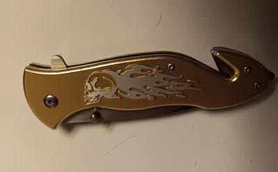 Cuchillo de Bolsillo Plegable Dorado Llamas Calavera Lavado a la Piedra Táctico Todo Metal Foto 1 de 4