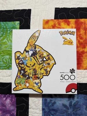 Rompecabezas en forma de Pikachu Buffalo Games Pokemon 500 piezas 18 x 27 Foto 1 de 4