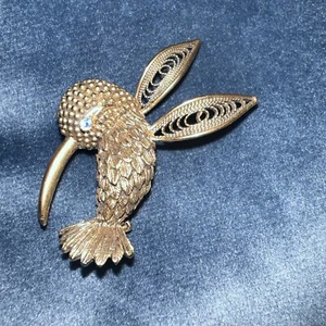 Vintage J.J. Goldtone Hummingbird With A Small Blue Gem Eye Brooch - Picture 1 of 3