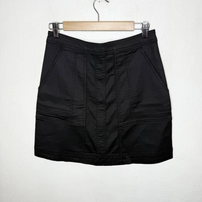 Minifalda de mezclilla elástica negra Cabi línea A cremallera con bolsillos para mujer talla 2 Foto 1 de 4