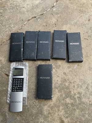 High end MOVADO calculator & TRAVEL ALARM CLOCK, brand new. Great gifts