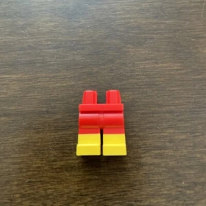 LEGO 970c00pb0575 RED Hips and Legs with Molded Yellow Lower Legs / Boots Patter - Picture 1 of 3