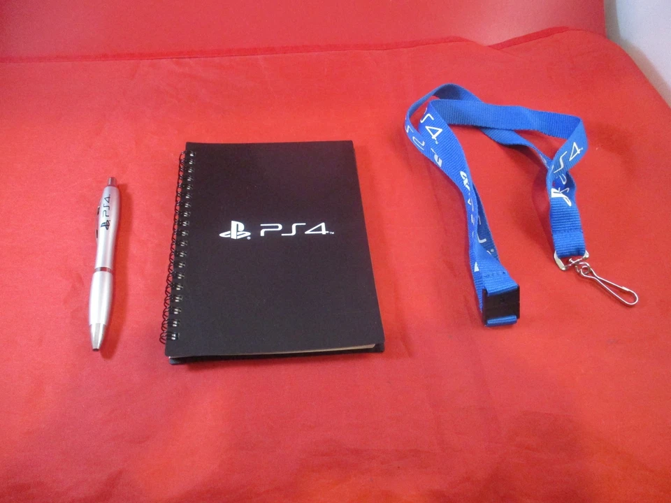 Sistema de consola Sony Playstation 4 PS4 portátil promocional + bolígrafo y cordón de empleado Foto 1 de 4
