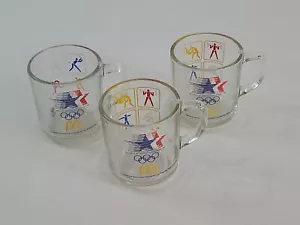 Vintage 1984 McDonalds LA Olympics Committee Clear Glass Coffee Mug Set of 3 - Picture 1 of 5