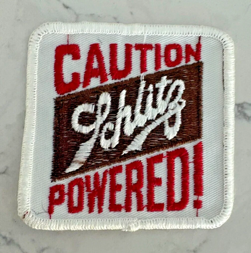 Caution Schlitz Powered Red White-Trim Sewing & Craft Embroidered Sew-On Patch - Image 1 of 2