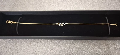 Brazalete Swiss Star Zirconia en oro rosa de 18 quilates sobre plata de ley de 7,5" Foto 1 de 4