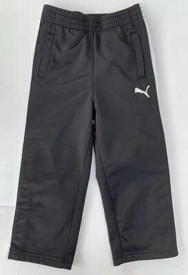 Pantalones deportivos Puma blancos y negros 2T botones todo el camino hacia abajo para niños Foto 1 de 4