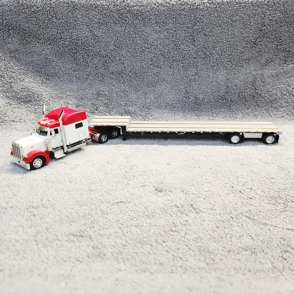 DCP DC WhtRed Peterbilt 379 Mid Roof Sleeper W/ Transcraft Step Deck Trailer. - Image 1 of 4