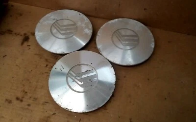 Juego de tres cubiertas de tapacubos centrales Mercury Sable 1996-1998  Foto 1 de 2