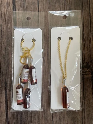 Juego de 2 dijes y collar bolsa dorada Love Wine Foto 1 de 4