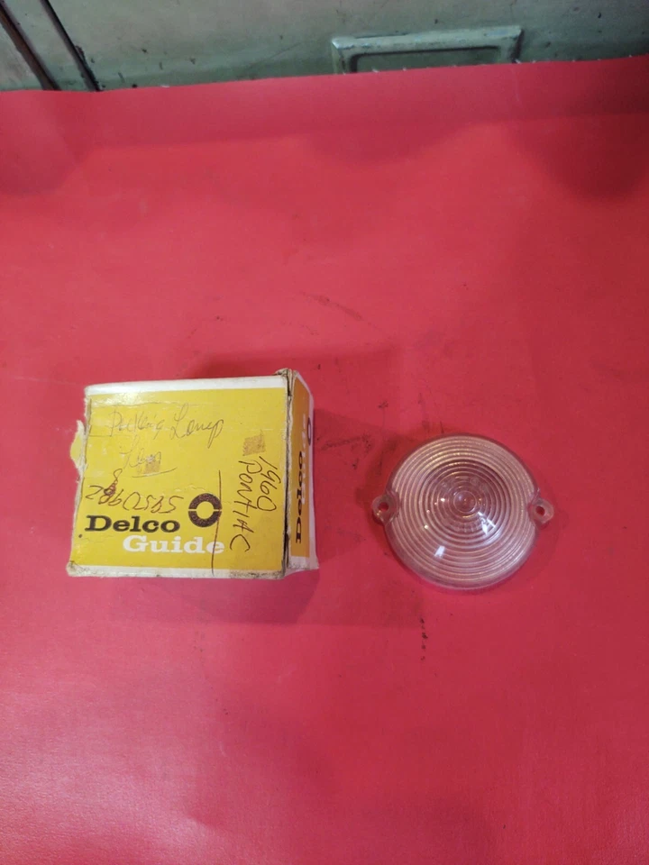 NOS GM OEM 1960 60 PONTIAC BONNEVILLE Delco Lente guía Luz de estacionamiento Lámpara giratoria Foto 1 de 4