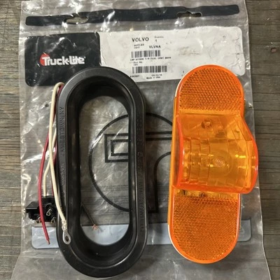 Par de lentes Trucklite modelo 60 ámbar/amarillo con ojal de goma señal de giro EE. UU. Foto 1 de 2