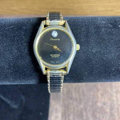 Reloj Navarra Diamante Cuarzo, Tono Dorado Negro Cara Redonda, Piedra a 12 Foto 1 de 4