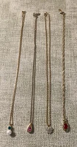 Collane vintage 20"" con ciondoli lotto di 4 in tonalità oro con pietre - Foto 1 di 3