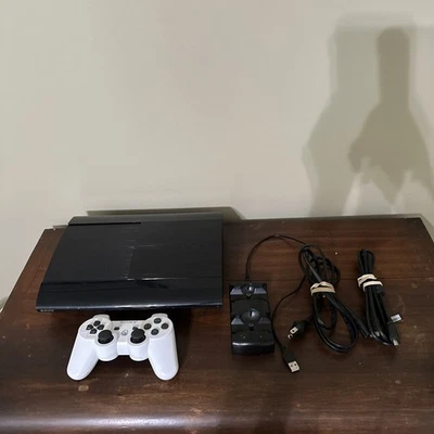 PS3 Super Slim with White DualShock 3 and Charging Station - Image 1 of 4