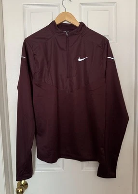Camisa Nike Para Hombre Esfera Media Therma-FIT Correr 1/2 Cremallera Borgoña FZ1115-652 Foto 1 de 4