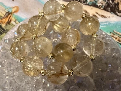 Pulsera de cuentas de cuarzo rutilado dorado.con espaciadores de oro macizo de 14k Foto 1 de 2