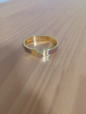 Brazalete Brazalete Hermes Clic Clac Usado Excelente Estado. Dorado y marrón. Sin caja Foto 1 de 4