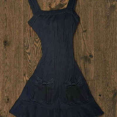 Little black dress By Esley With pleated bow pockets. Size Small - Image 1 of 4
