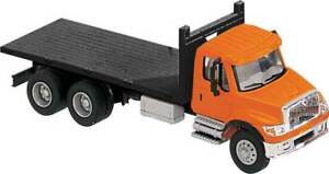 Walthers HO Scale International 7600 3-Axle Flatbed Truck Orange Cab/Black Bed