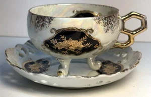 Taza de té y platillo con patas iridiscentes vintage RARO negro con detalles dorados Japón - Imagen 1 de 23