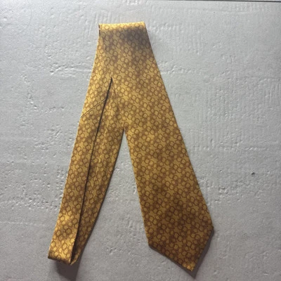 Corbata para hombre Hermes dorada con patrón geométrico Foto 1 de 4