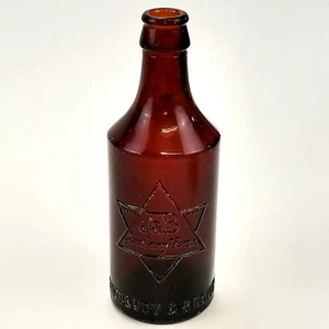 Antique Amber Glass Bottle Jewsbury & Brown Manchester J&B Star Embossed - Foto 1 di 13