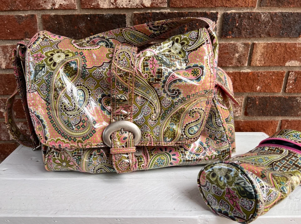 Bolsa de pañales para bebé mensajero con hebilla laminada Kalencom + portabiberones - Usada Foto 1 de 4