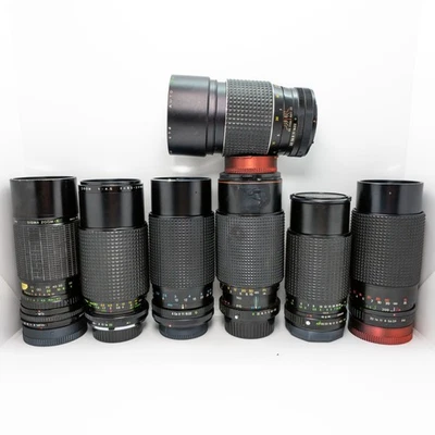 Lot of 7 vintage zoom lenses. Haze or fungus in each. - Image 1 of 4