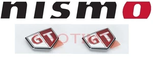Insignia emblema guardabarros delantero Nissan genuino BNR34 SKYLINE GTR 2 piezas OEM JDM - Imagen 1 de 1