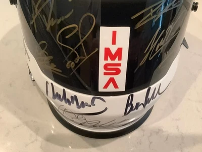 HELIO CASTRONEVES + 59 DRIVERS SIGNED 2024 IMSA HELMET, 54 CARDS & LICENSE PLATE - Image 1 of 4