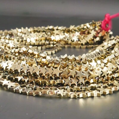 NELLYS  Strang Hämatit Perlen Sterne glänzend pyrit farben 6mm Edelsteine ca. 80 - Bild 1 von 3